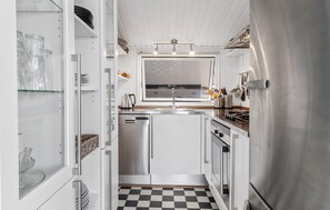 Fridge, stovetop, dishwasher, coffee/tea maker