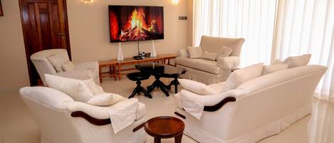 Premium House, Garden View | Living area | 43-inch Smart TV with digital channels