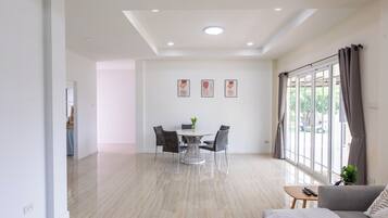 Family Villa | Living area | 35-inch LCD TV with cable channels, Netflix, streaming services