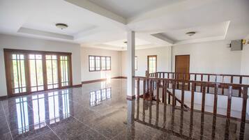 Deluxe Villa | Living area | 35-inch LCD TV with cable channels, Netflix, streaming services