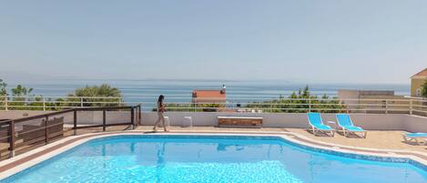 Seasonal outdoor pool, open 11:00 AM to 8:00 PM, pool loungers
