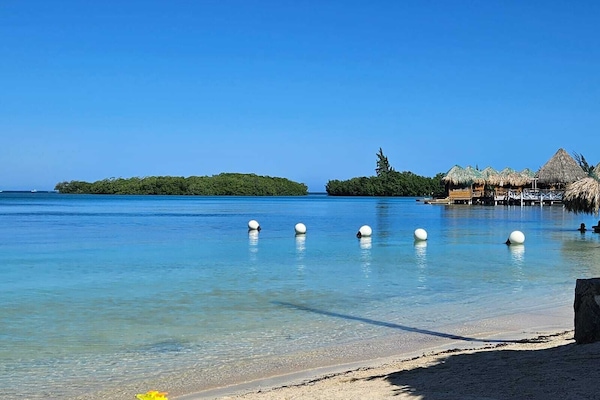 Private beach nearby, white sand, 2 beach bars