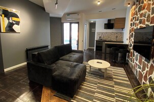 Family Apartment, 1 Bedroom | Desk, laptop workspace, iron/ironing board, free WiFi