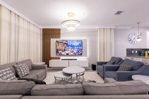 Living area - Modern Resort Home w/ Game Room and Theater, FREE Water Park! (Davenport)