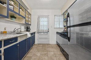 Fridge, stovetop, dishwasher, coffee/tea maker