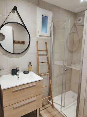 Shower, hair dryer, towels, soap