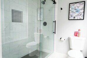 Shower, towels, soap, toilet paper