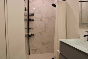 Shower, hair dryer, towels, soap