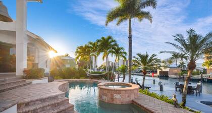 Tropical Oasis! - Luxury Canal Home! 1 Mile To The Beach! Heated Pool & Spa