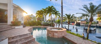 Tropical Oasis! - Luxury Canal Home! 1 Mile To The Beach! Heated Pool & Spa