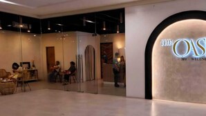 A modern interior with a reception area and a spa/wellness center named "The Oasis". - Bella Suite Bacolod (Bacolod)
