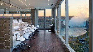 A modern conference room with a large window overlooking a waterfall. - The Brock Niagara Falls Fallsview, Tapestry by Hilton (Niagara Falls)