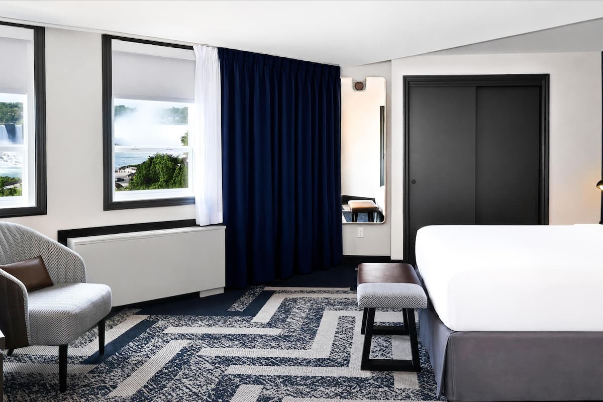 Room, 1 King Bed (Whirlpool tub w Falls View) | In-room safe, laptop workspace, blackout drapes, iron/ironing board