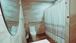 A modern bathroom with a large bathtub, two sinks, a toilet, and a shower curtain with a geometric pattern. - Walk to food & drinks, near lakes (Mossyrock)