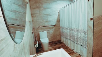 Shower, hair dryer, towels, soap