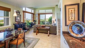 Una cocina amplia con comedor, ventanas grandes y vistas al exterior.