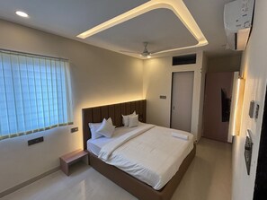 Desk, laptop workspace, blackout drapes, iron/ironing board