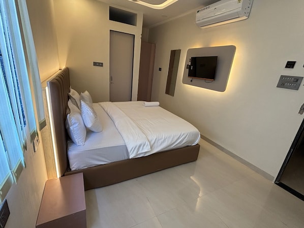 Desk, laptop workspace, blackout drapes, iron/ironing board