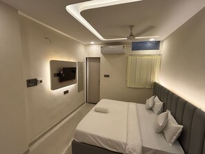 Family Triple Room, 1 King Bed, City View | Desk, laptop workspace, blackout drapes, iron/ironing board