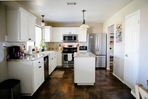 Fridge, coffee/tea maker, cookware/dishes/utensils