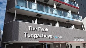 A multi-story building with a sign reading "The Peak Tengachaya by FMiJ". - The Peak Tengachaya (Osaka)