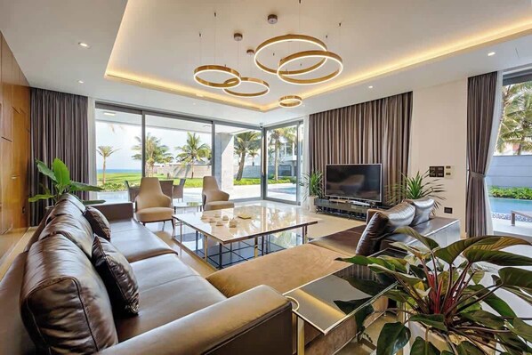 Villa, Multiple Beds, Pool Access, Pool View (OV K5a) | Living area | 42-inch flat-screen TV with digital channels - Oceanfront Elegance: 7-br Villa in Luxury Resort (Da Nang)