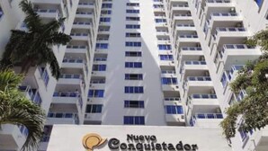 A high-rise building with multiple balconies and a sign reading "Nuevo Conquistador". - Cartagena apartment facing the sea for four guests (Cartagena)