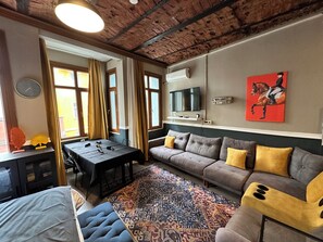 Suíte estúdio design | Área de estar | Smart TV, console de videogame, Netflix, Hulu