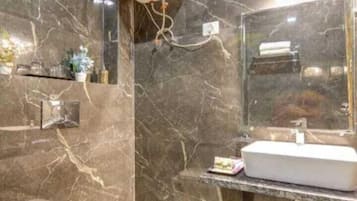 Shower, free toiletries, slippers, towels