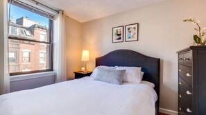 Comfort Apartment, Kitchen | 2 bedrooms, down comforters, desk, laptop workspace