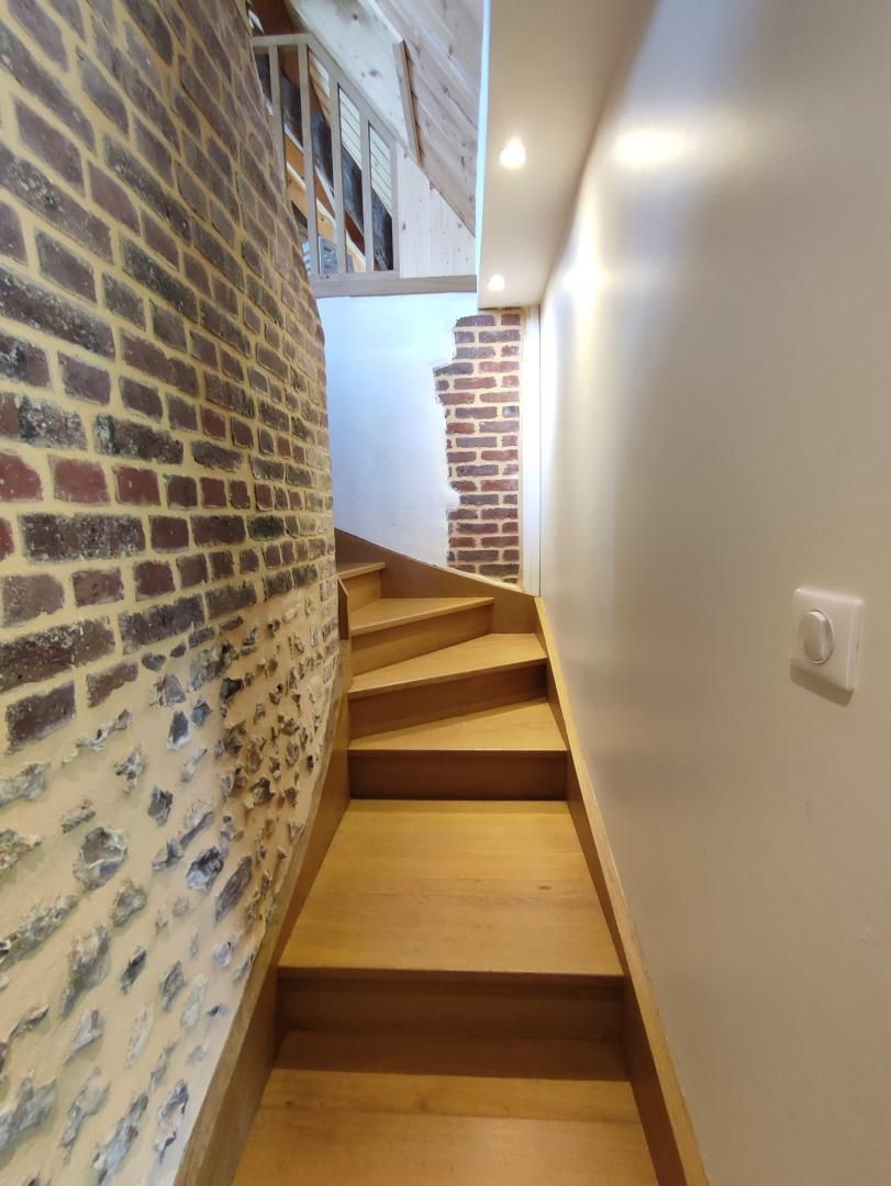 A staircase with wooden steps leading to a higher level.