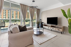 Grand Apartment, 1 King Bed | Living area | 50-inch Smart TV with digital channels - Silkhaus Al Naseem (Abu Dhabi)
