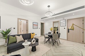 Deluxe Apartment, Balcony | Living area | Smart TV - Silkhaus Empire Residence (Dubai)