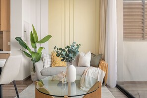 Family Apartment, 1 King Bed | Living area | 50-inch Smart TV with cable channels - Silkhaus Oakley Square Residence (Dubai)