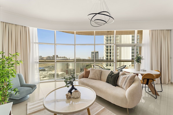 Premier Apartment, 1 King Bed | Living area | 50-inch Smart TV with digital channels - Silkhaus Reef Residence (Dubai)