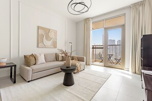 Deluxe Apartment | Living area | 50-inch Smart TV with digital channels - Silkhaus Reflection Tower (Abu Dhabi)