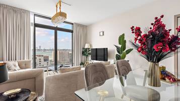 Exclusive Apartment, 1 King Bed | Living area | 50-inch Smart TV with digital channels