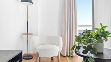 Grand Studio, 1 Queen Bed | Living area | 50-inch Smart TV with digital channels