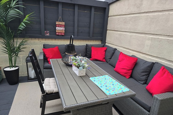 A stunning sunroom / patio with outdoor furniture