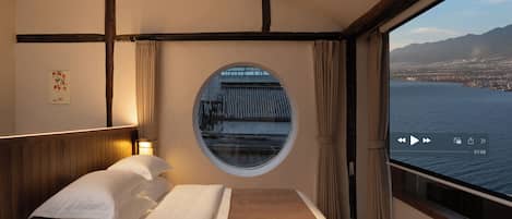Deluxe Single Room, 1 King Bed, Private Bathroom, Garden View | Free minibar, desk, laptop workspace, blackout drapes