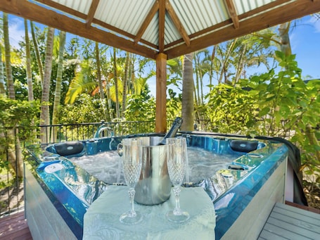Outdoor spa tub. Synergy Beachside Nudist Retreat QB/Hot tub Heated pool private gardens