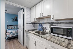 Fridge, microwave, stovetop, coffee/tea maker