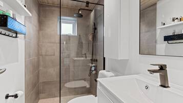 Shower, towels, soap, toilet paper