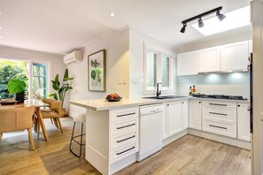 Dishwasher, coffee/tea maker, cookware/dishes/utensils