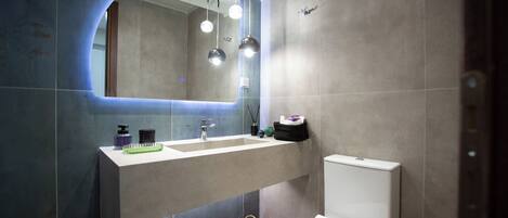 Shower, hair dryer, towels, soap