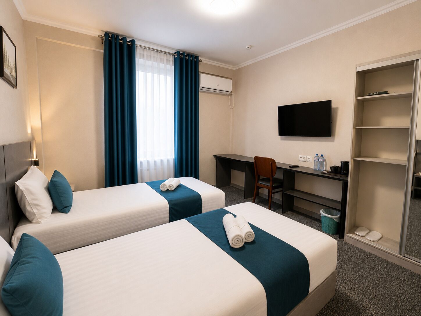 Deluxe Twin Room, Courtyard View | Desk, laptop workspace, blackout drapes, iron/ironing board