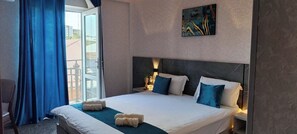 Deluxe Double Room, 1 King Bed, Courtyard View | Desk, laptop workspace, blackout drapes, iron/ironing board