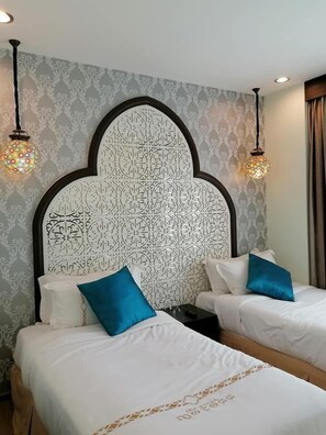 Deluxe Triple Room, Balcony | In-room safe, desk, laptop workspace, blackout curtains
