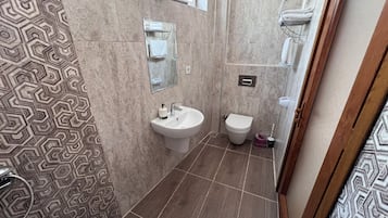 Hair dryer, slippers, towels, soap