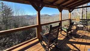 A wooden deck with a view of mountains and trees. - Rocking on Heaven's Door-Covered Porch -  WIFI - Gas Grill (Topton)
